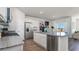 Modern kitchen featuring white cabinets, stainless steel appliances, granite countertops, and an island with seating at 311 Glade Ct., Loris, SC 29569