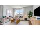 Bright living room with modern decor, a comfortable sofa, stylish pillows, and a view of the outdoors at 311 Glade Ct., Loris, SC 29569