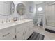 Modern bathroom with double sinks, stylish mirrors, and a walk-in shower at 312 47Th Ave. N, North Myrtle Beach, SC 29582