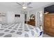 Comfortable bedroom with an en-suite bathroom, neutral walls, ceiling fan and wood furnishings at 312 47Th Ave. N, North Myrtle Beach, SC 29582