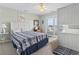 Inviting bedroom with a ceiling fan, sliding glass doors, and comfortable seating area at 312 47Th Ave. N, North Myrtle Beach, SC 29582