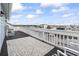 Spacious deck with chairs overlooking the waterfront offering ample seating and scenic views at 312 47Th Ave. N, North Myrtle Beach, SC 29582