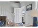 Bright entryway with hardwood floors, white staircase, and an open front door at 312 47Th Ave. N, North Myrtle Beach, SC 29582