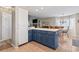 Kitchen island with blue cabinets opens up to a spacious dining and living area at 312 47Th Ave. N, North Myrtle Beach, SC 29582