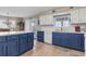 Spacious kitchen with blue cabinets, white countertops, and modern appliances at 312 47Th Ave. N, North Myrtle Beach, SC 29582