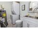 Laundry room features a stacked washer and dryer, utility sink, and ample storage at 312 47Th Ave. N, North Myrtle Beach, SC 29582