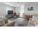 Cozy living room with neutral walls, a ceiling fan, comfortable seating, and a TV at 312 47Th Ave. N, North Myrtle Beach, SC 29582