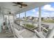 Screened-in porch with water views offering comfortable seating and a relaxing atmosphere at 312 47Th Ave. N, North Myrtle Beach, SC 29582