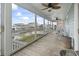 Large screened porch with wicker furniture and ceiling fans overlooking the waterfront at 312 47Th Ave. N, North Myrtle Beach, SC 29582