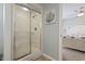 Clean shower with a sliding glass door, next to the light and airy bedroom at 312 47Th Ave. N, North Myrtle Beach, SC 29582