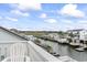 Scenic view from a deck overlooking a canal, waterfront homes, and lush greenery at 312 47Th Ave. N, North Myrtle Beach, SC 29582