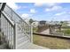 Exterior shot of a yard leading to the waterway with a boardwalk and staircase at 312 47Th Ave. N, North Myrtle Beach, SC 29582