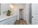 Bright bathroom with double vanity, quartz countertop, modern fixtures, and a tiled shower at 334 Glacier Way, Conway, SC 29526