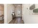 View of the entryway with wood-look flooring and decor, illuminated by recessed lighting at 334 Glacier Way, Conway, SC 29526