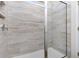 Modern bathroom shower with stylish tile, glass door, and built-in shelving for added convenience at 334 Glacier Way, Conway, SC 29526
