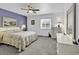 Serene bedroom with soft gray carpet, a calming blue accent wall, and ample natural light at 405 N Hillside Dr. N # C3, North Myrtle Beach, SC 29582
