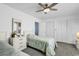 Bright bedroom with two beds, ceiling fan, neutral carpet, and large closets at 405 N Hillside Dr. N # C3, North Myrtle Beach, SC 29582