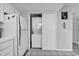 Convenient laundry closet located next to the refrigerator with washer and dryer units at 405 N Hillside Dr. N # C3, North Myrtle Beach, SC 29582