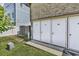 Exterior storage units with white doors on a well-maintained lawn at 405 N Hillside Dr. N # C3, North Myrtle Beach, SC 29582