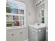Bright bathroom with a window, natural light, a gray vanity, and fixtures at 408 Chesterfield Ct., Myrtle Beach, SC 29577
