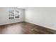 Bedroom featuring a large window and wood-look flooring at 408 Chesterfield Ct., Myrtle Beach, SC 29577