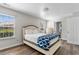 Cozy bedroom with plenty of natural light, a bed, and a view of the ensuite bathroom and hallway at 408 Chesterfield Ct., Myrtle Beach, SC 29577
