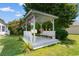 Inviting gazebo with benches, hanging plants, and lush green surroundings at 408 Chesterfield Ct., Myrtle Beach, SC 29577