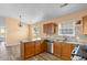 The modern kitchen features stainless appliances, granite countertops, and tile backsplash at 408 Chesterfield Ct., Myrtle Beach, SC 29577