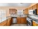 The modern kitchen features stainless appliances, granite countertops, and custom backsplash at 408 Chesterfield Ct., Myrtle Beach, SC 29577