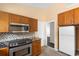 Bright kitchen featuring stainless steel appliances, wooden cabinets, and tiled backsplash at 408 Chesterfield Ct., Myrtle Beach, SC 29577