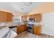 The modern kitchen features stainless appliances, granite countertops, and custom backsplash at 408 Chesterfield Ct., Myrtle Beach, SC 29577