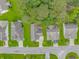 Bird's eye view showcases the home with a neat backyard setup, surrounded by a neighborhood and trees at 409 Hunley Ln., Myrtle Beach, SC 29577
