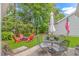 Backyard featuring a patio with seating areas and views of a lush green yard at 409 Hunley Ln., Myrtle Beach, SC 29577
