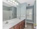 Bathroom boasting a double vanity with a large mirror and a tub/shower combo at 409 Hunley Ln., Myrtle Beach, SC 29577