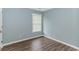 Bedroom featuring wood-look flooring, and a window that allows in natural lighting at 409 Hunley Ln., Myrtle Beach, SC 29577