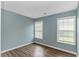 Peaceful bedroom with neutral paint, laminate flooring, and natural light from the windows at 409 Hunley Ln., Myrtle Beach, SC 29577