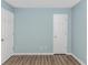Bedroom featuring wood-look flooring, neutral paint, and a view of the closet at 409 Hunley Ln., Myrtle Beach, SC 29577