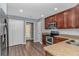 Well-equipped kitchen with stainless steel appliances, dark wood cabinets and ample countertop space at 409 Hunley Ln., Myrtle Beach, SC 29577