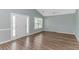 Bright, open living room with soaring ceilings and beautiful laminate wood flooring at 409 Hunley Ln., Myrtle Beach, SC 29577
