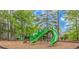 Community playground featuring a green slide and play area with mulch at 409 Hunley Ln., Myrtle Beach, SC 29577