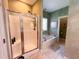 Well-lit bathroom with separate tub and shower, and tile flooring at 4266 Arabella Way, Little River, SC 29566