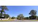 Entrance to Bellacroft community featuring manicured landscaping and clear signage at 4266 Arabella Way, Little River, SC 29566