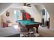 Finished attic space features a pool table, ceiling fan, and natural light at 4266 Arabella Way, Little River, SC 29566