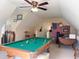 Finished attic space features a pool table, ceiling fan, and neutral carpeting at 4266 Arabella Way, Little River, SC 29566