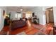 Bright living room with hardwood floors and open layout to dining and outdoor spaces at 4266 Arabella Way, Little River, SC 29566