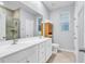 Modern bathroom featuring a double sink vanity and storage shelving at 4698 Cloisters Ln., Myrtle Beach, SC 29577