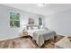 Inviting bedroom with natural light, comfy bed, and stylish decor at 4698 Cloisters Ln., Myrtle Beach, SC 29577
