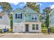 Charming two-story home with a garage, a wreath on the door, and a beautifully painted exterior at 4698 Cloisters Ln., Myrtle Beach, SC 29577
