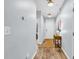 Hallway featuring neutral walls, hardwood floors, and multiple entry points at 4698 Cloisters Ln., Myrtle Beach, SC 29577