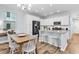 Kitchen featuring white cabinets, stainless steel appliances, granite countertops, and hardwood flooring at 4698 Cloisters Ln., Myrtle Beach, SC 29577